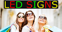 girls looking at sign