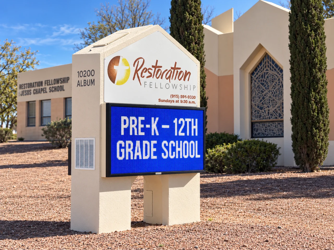 Restoration Fellowship LED sign displaying Pre-K through 12th grade school