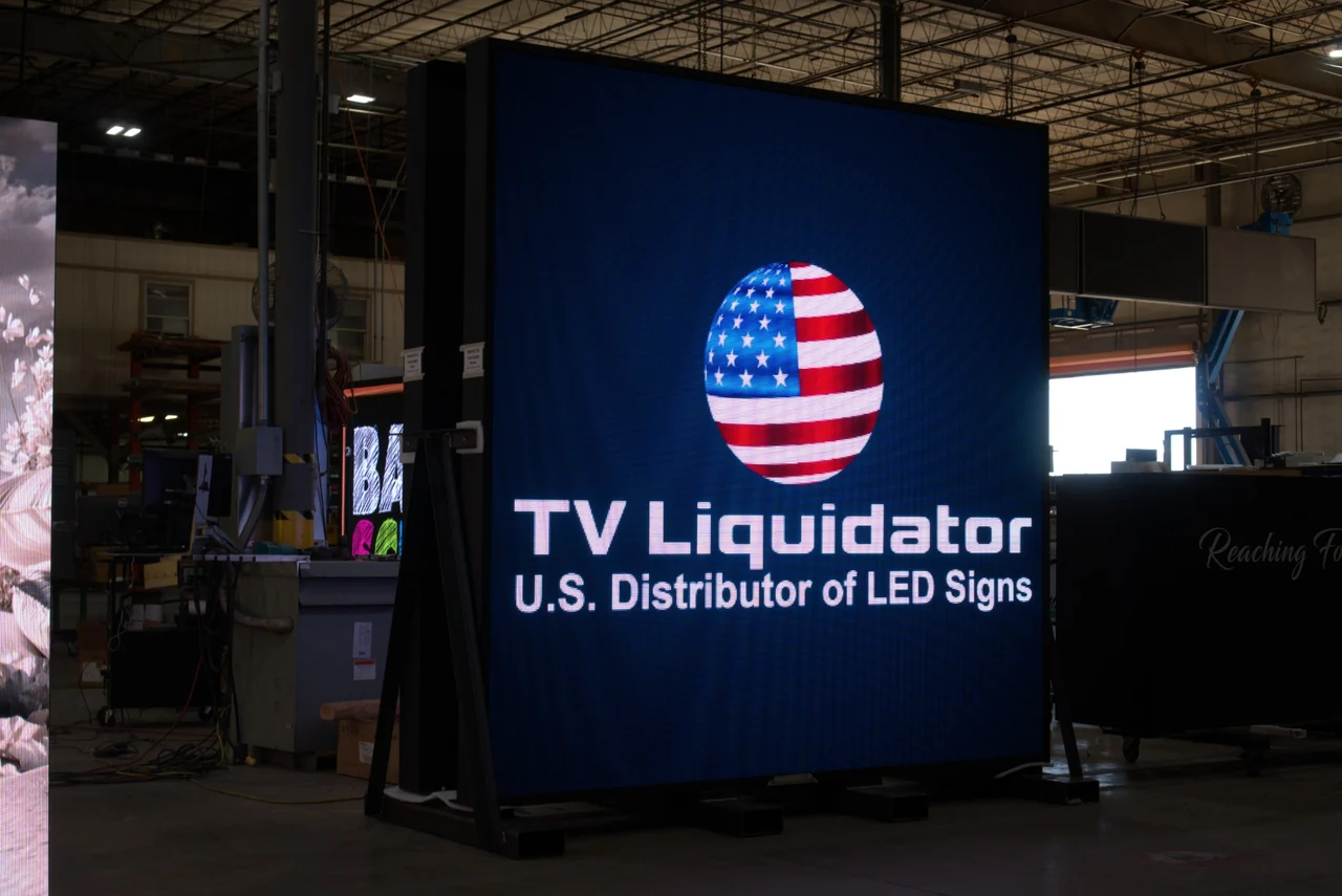 TV Liquidator branding on a large LED display